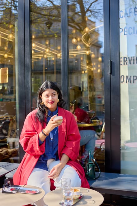 Mishar with a coffee at a Paris café terrace